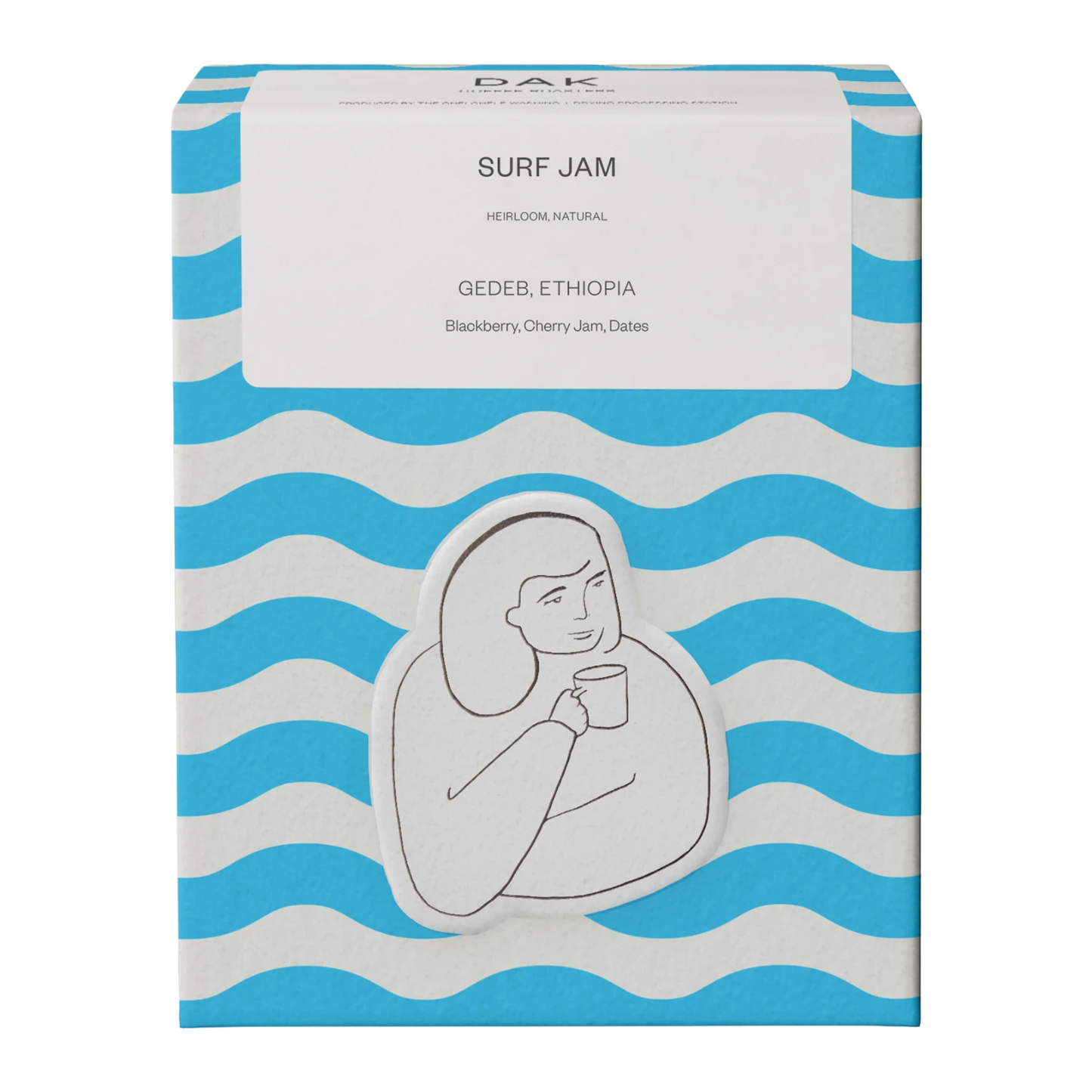 Blue and white wavy box of DAK Coffee Roasters Surf Jam Gedeb Ethiopia Whole Beans with a black outline drawing of a person holding a mug