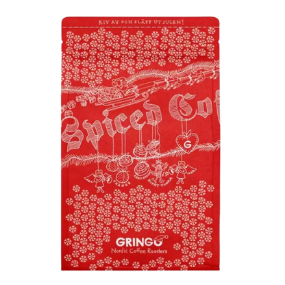 A red Christmas-themed coffee bag featuring white illustrations of a Santa train, ornaments, and snowflakes, with the brand name 'Gringo Nordic' printed at the bottom.