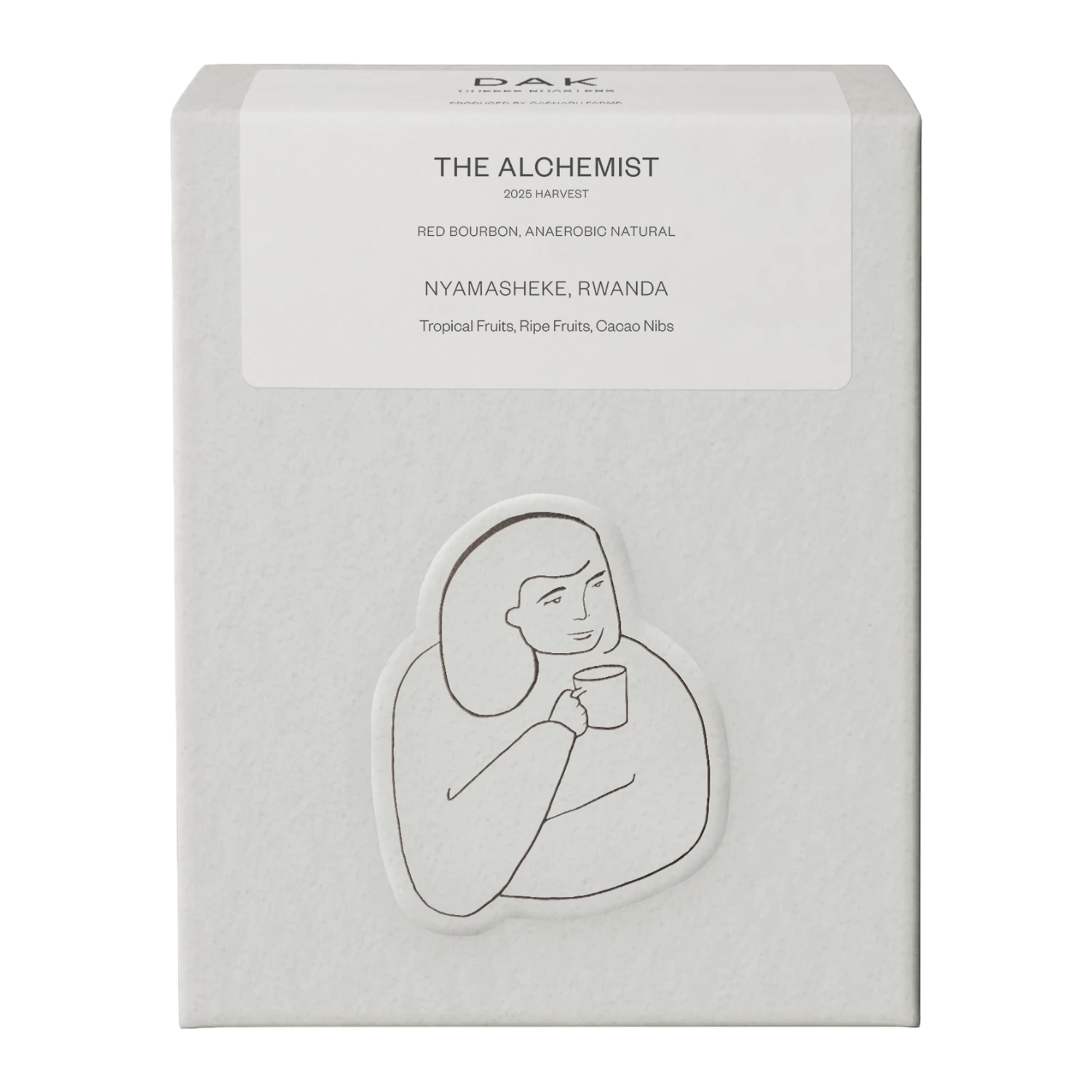 White box of DAK Coffee Roasters Rwanda The Alchemist Filter Whole Beans with black on white drawing of a person