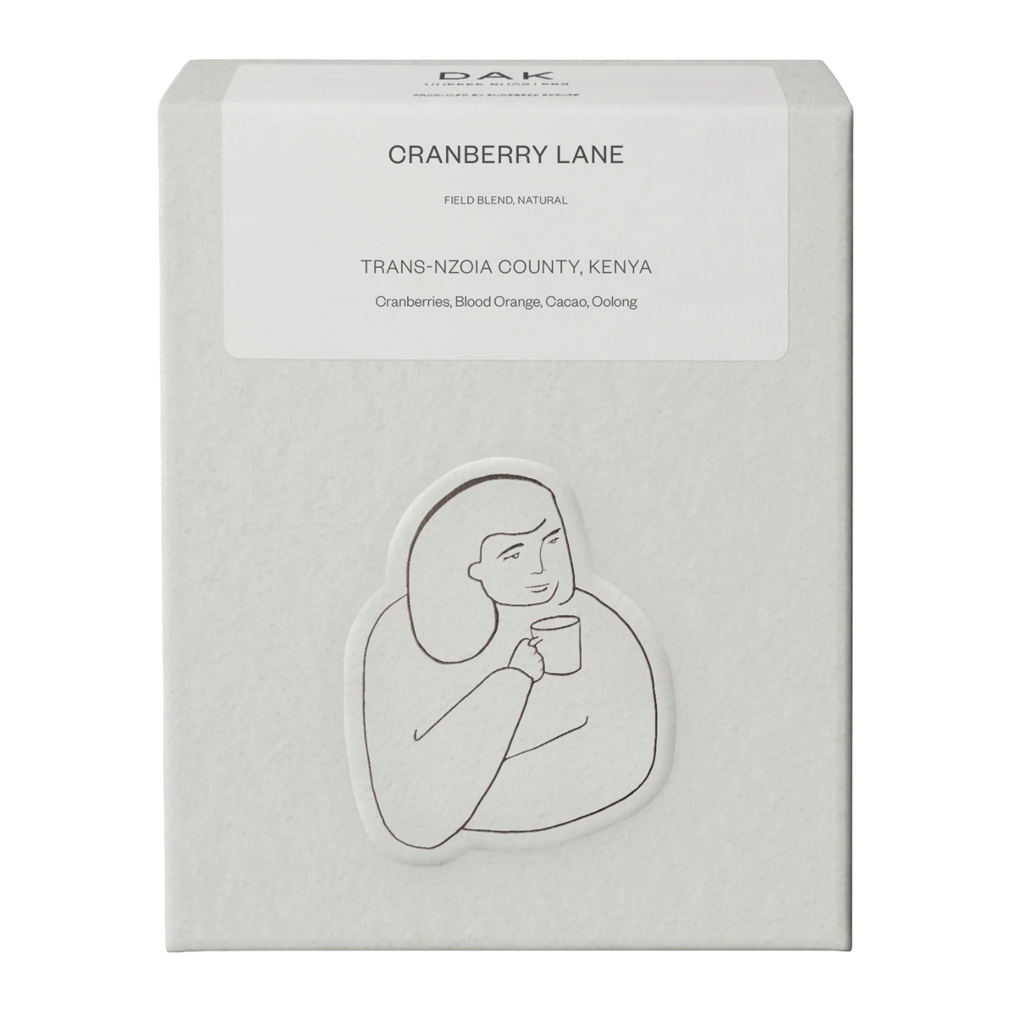 White box of DAK Coffee Roasters Kenya Cranberry Lane Filter Whole Beans with black on white drawing of a person