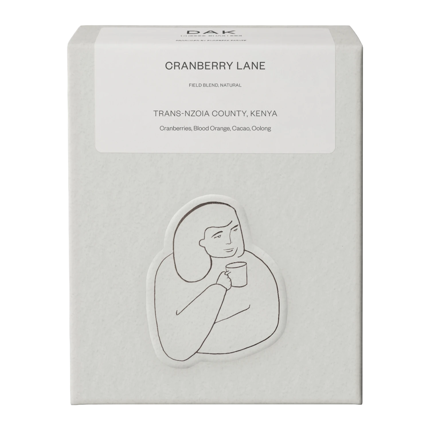White box of DAK Coffee Roasters Kenya Cranberry Lane Filter Whole Beans with black on white drawing of a person