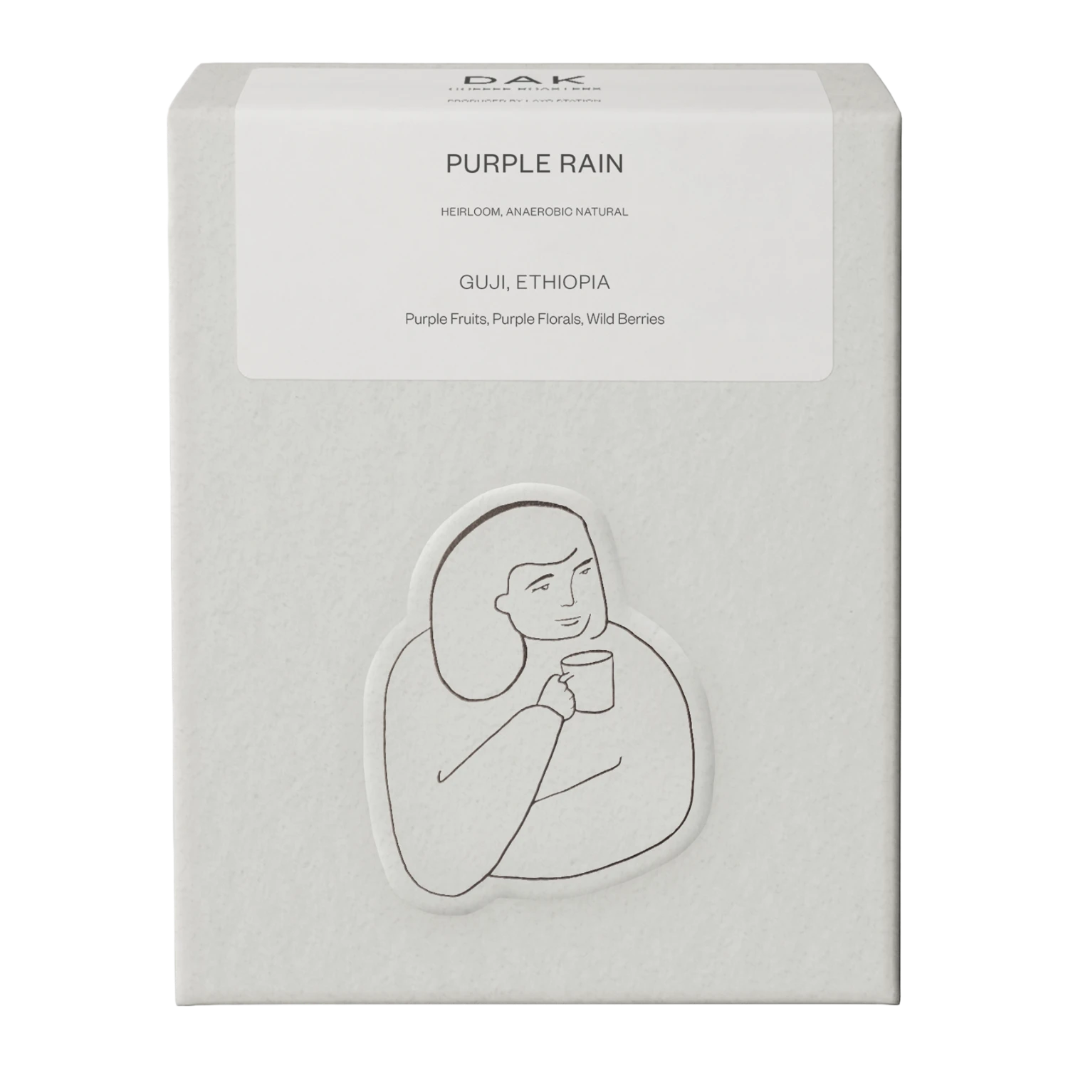 White box of DAK Coffee Roasters Purple Rain Filter Whole Beans with black on white drawing of a person