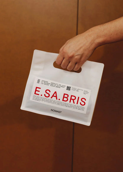 Hand holding Nomad Coffee E.SA.BRIS Salvador coffee bag