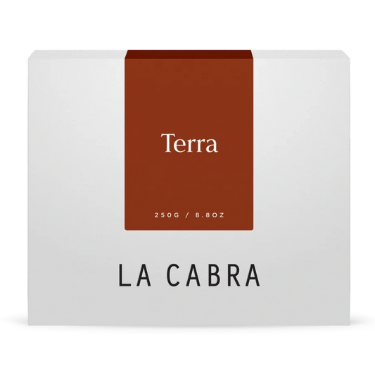 La Cabra "Terra" coffee packaging with a white background and a dark orange label