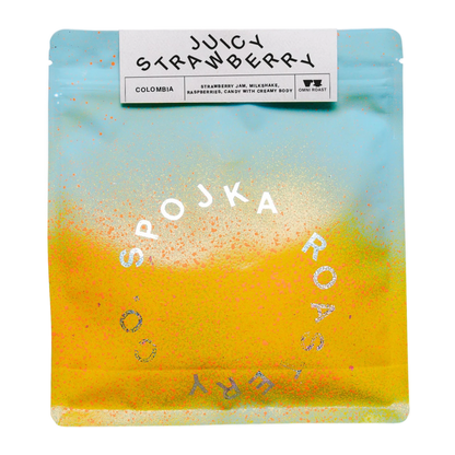 Coffee package with 'Juicy Strawberry' flavor and 'SPOJKA ROASTERY' branding on a white background