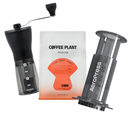 Hario coffee grinder, Coffee Plant package, and AeroPress Original on a white background