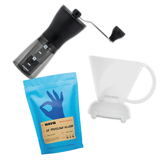 Hario Mini Mill coffee grinder, Hayb Sie Przelewa coffee bag, and Clever Dripper on a white background