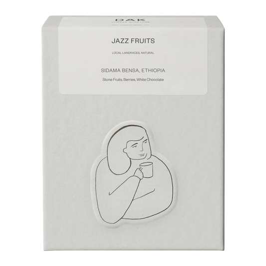 White box of DAK Coffee Roasters Jazz Fruit Espresso Whole Beans with black on white drawing of a person