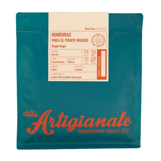 Teal coffee bag with a cream label reading 'HONDURAS FINCA EL PUENTE WASHED' and large orange 'ditta Artigianale' branding near the bottom.