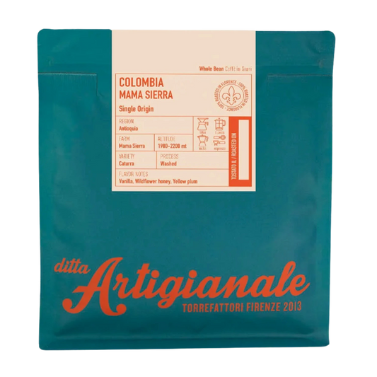 A bag of Ditta Artigianale coffee specifically Colombia Mama Sierra single origin, in a teal pouch with a cream-colored label and orange-red branding.