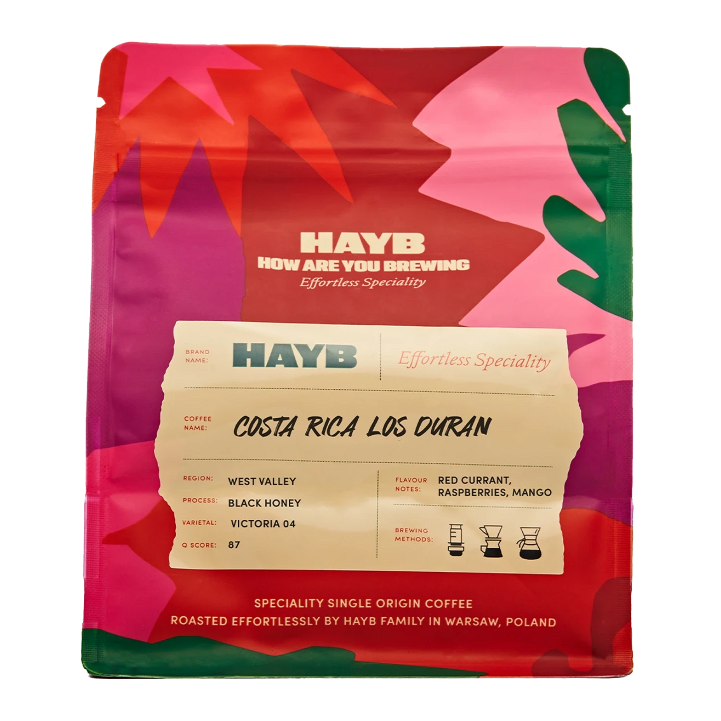 En påse HAYB Costa Rica Los Duran specialkaffe med ett färgglatt abstrakt mönster i rosa, rött och grönt.