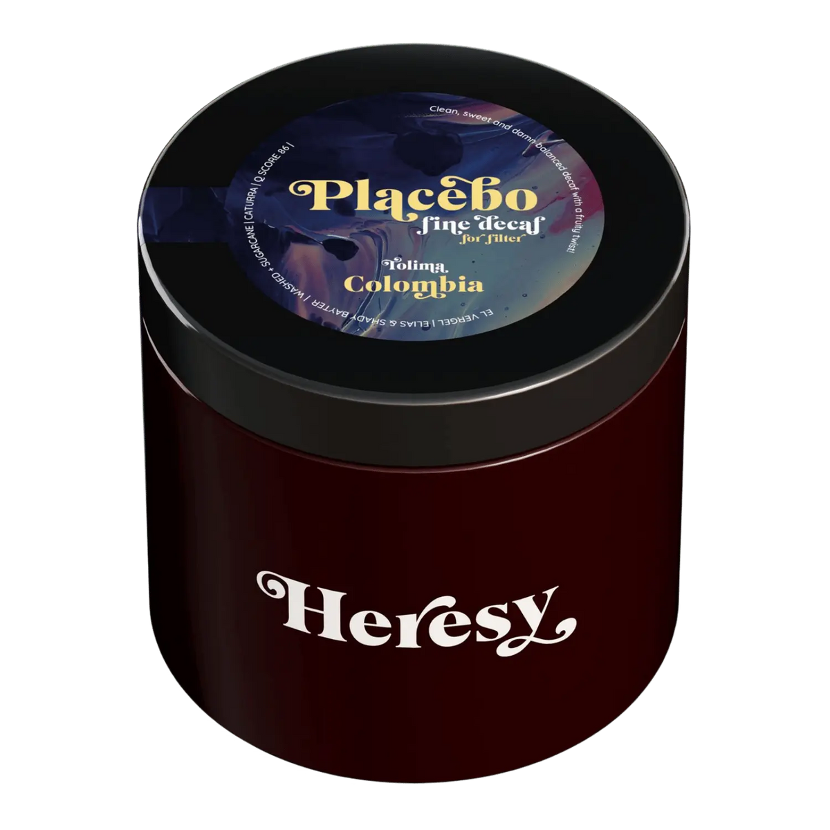 A dark red cylindrical jar with a black lid featuring a 'Heresy' logo and a colorful 'Placebo fine decaf for filter'  top label.