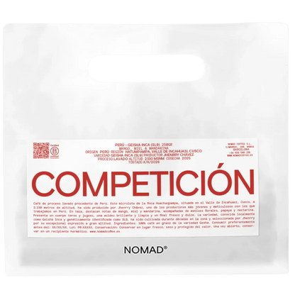 A white bag of NOMAD brand coffee with a prominent white label featuring the brand name 'COMPETICION'.