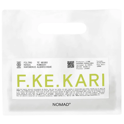 A white bag of NOMAD brand coffee with a prominent white label featuring the brand name 'F.KE.KARI'.
