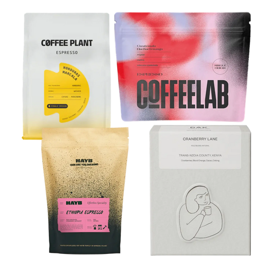 Four coffee bags from different brands on a white background