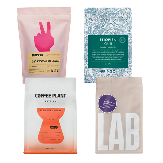 Four coffee packages with different designs on a white background