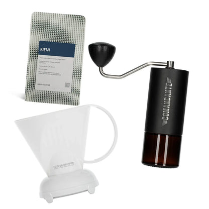 Commandante coffee grinder, Coffee Collective filter coffee bag, and white Clever Dripper on a white background