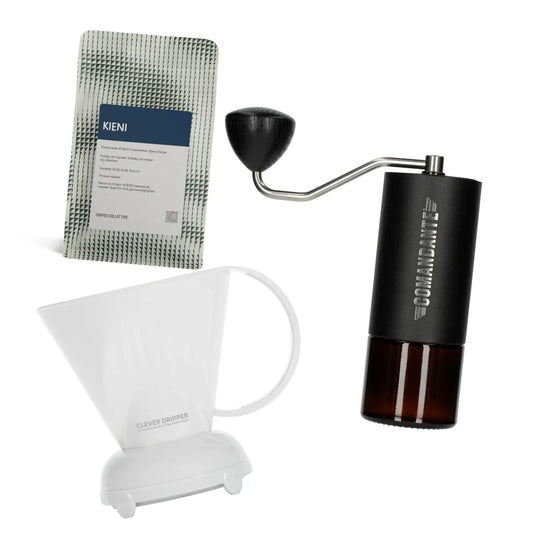 Commandante coffee grinder, Coffee Collective filter coffee bag, and white Clever Dripper on a white background